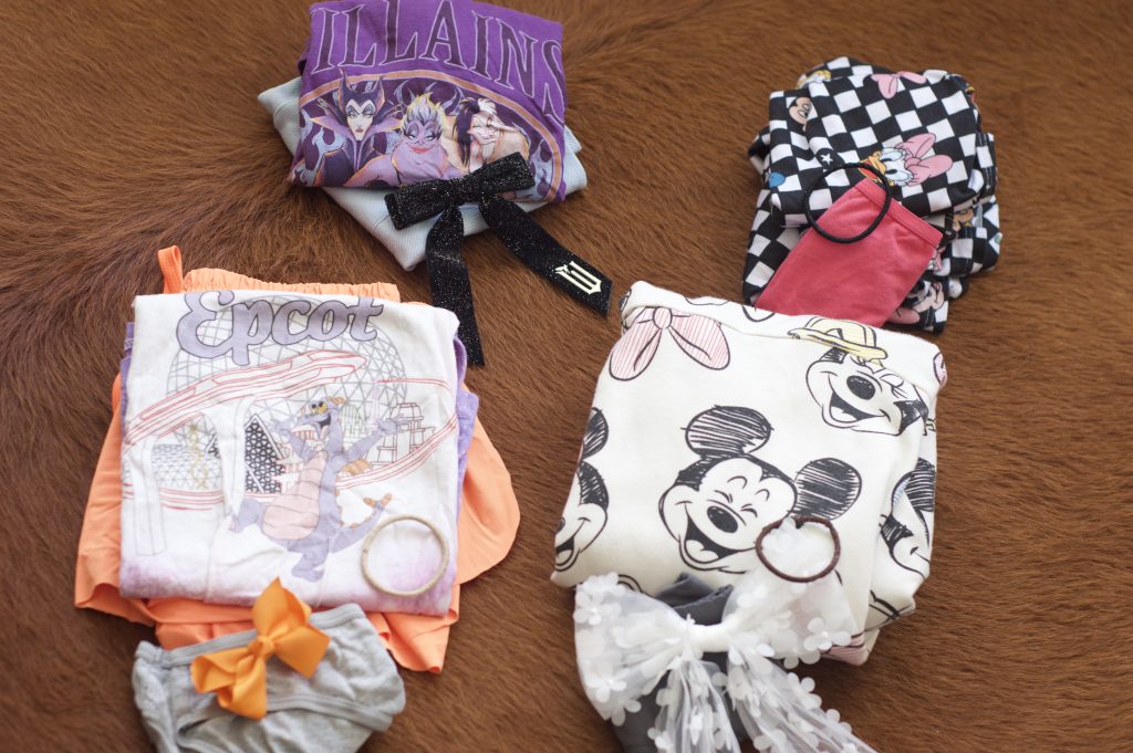 Disney outfits with bows to be packed for Disney World