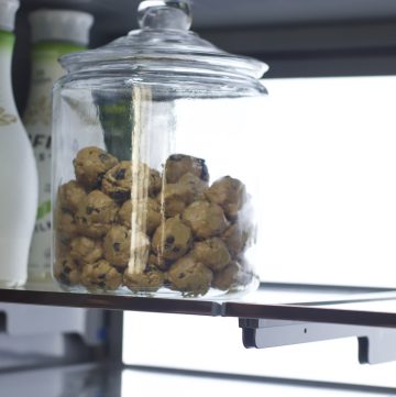 homemade protein balls in glass jar in fridge