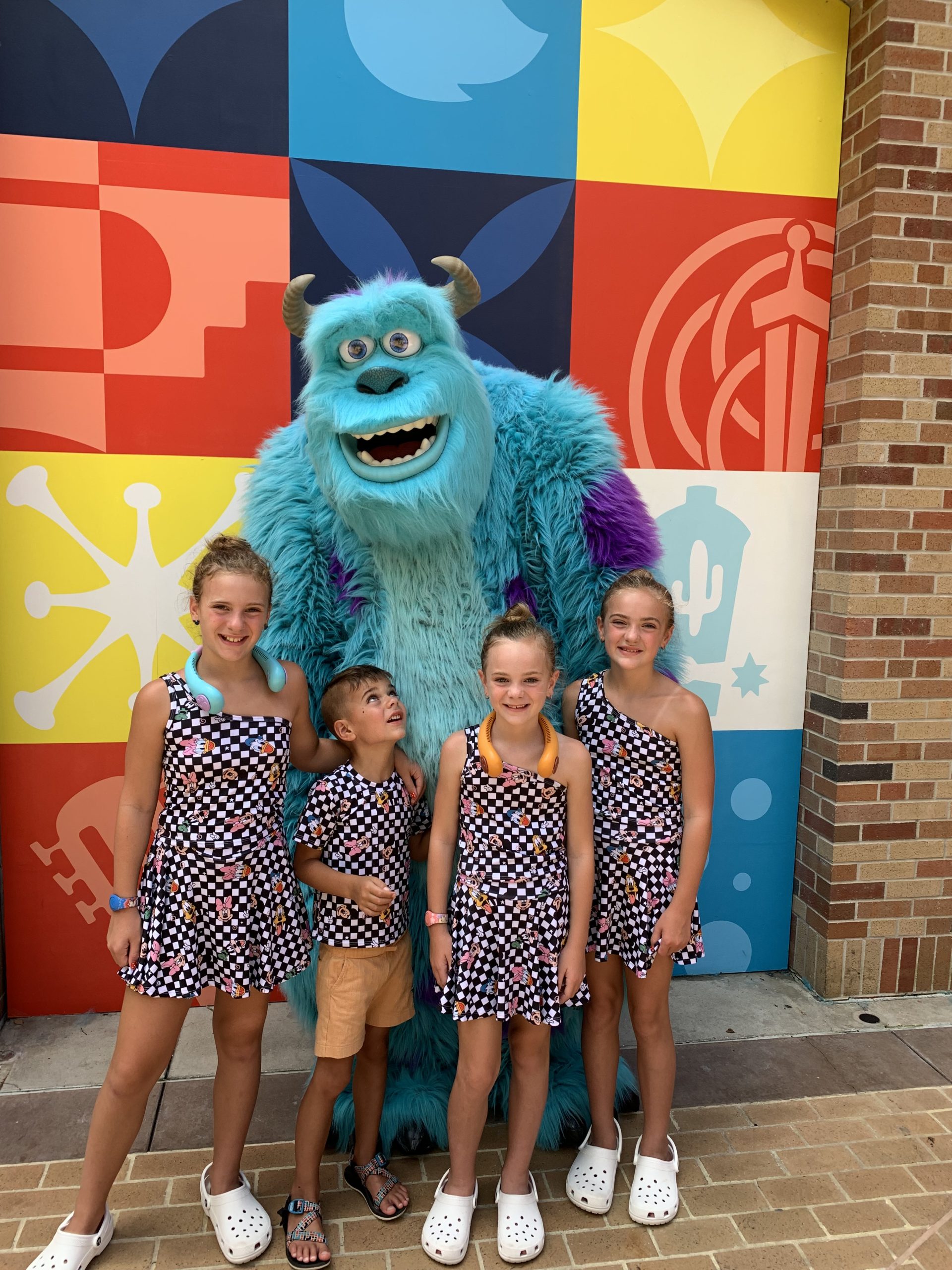 Hollywood Studios with sully from monsters inc and four kids